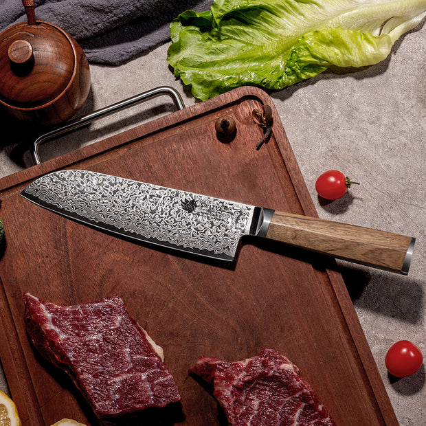 “Professional chef knife with wooden handle on cutting board”