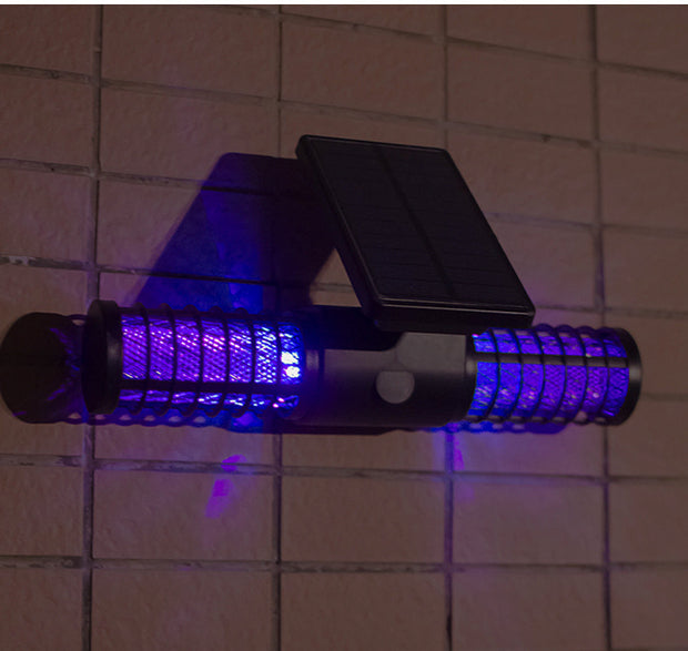 Solar mosquito killer lamp glowing in the dark