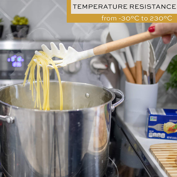 Utensils arranged in a bucket on kitchen counter