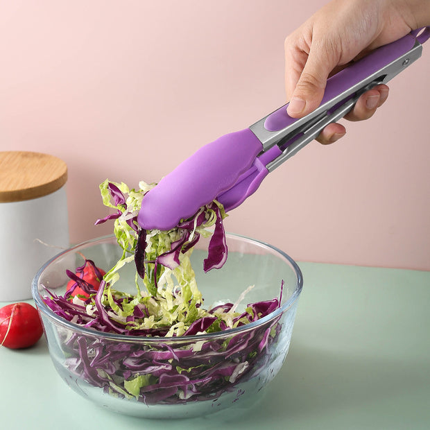 "Silicone tongs serving fresh salad"