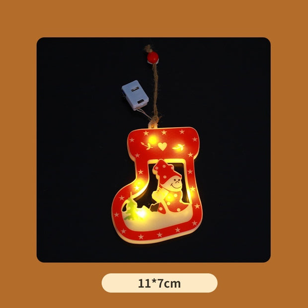 Christmas house and bell ornaments glowing
