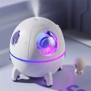Desktop space capsule humidifier misting in dark room
