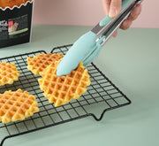 "Silicone food clip holding waffles"