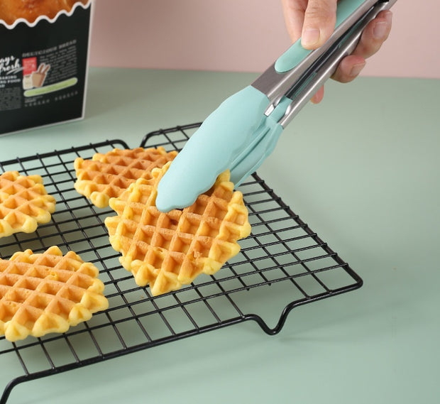 "Silicone food clip holding waffles"