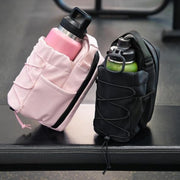 Fitness Magnetic Kettle Bag holding water bottle at gym