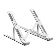 Portable aluminum laptop stand on desk
