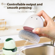 Soap dispensing dishwashing brush with long handle
